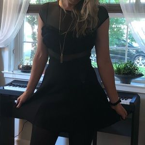 Bebe mini dress with floral accent.